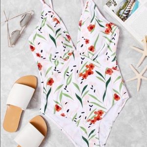 One piece swim suit. Light floral print